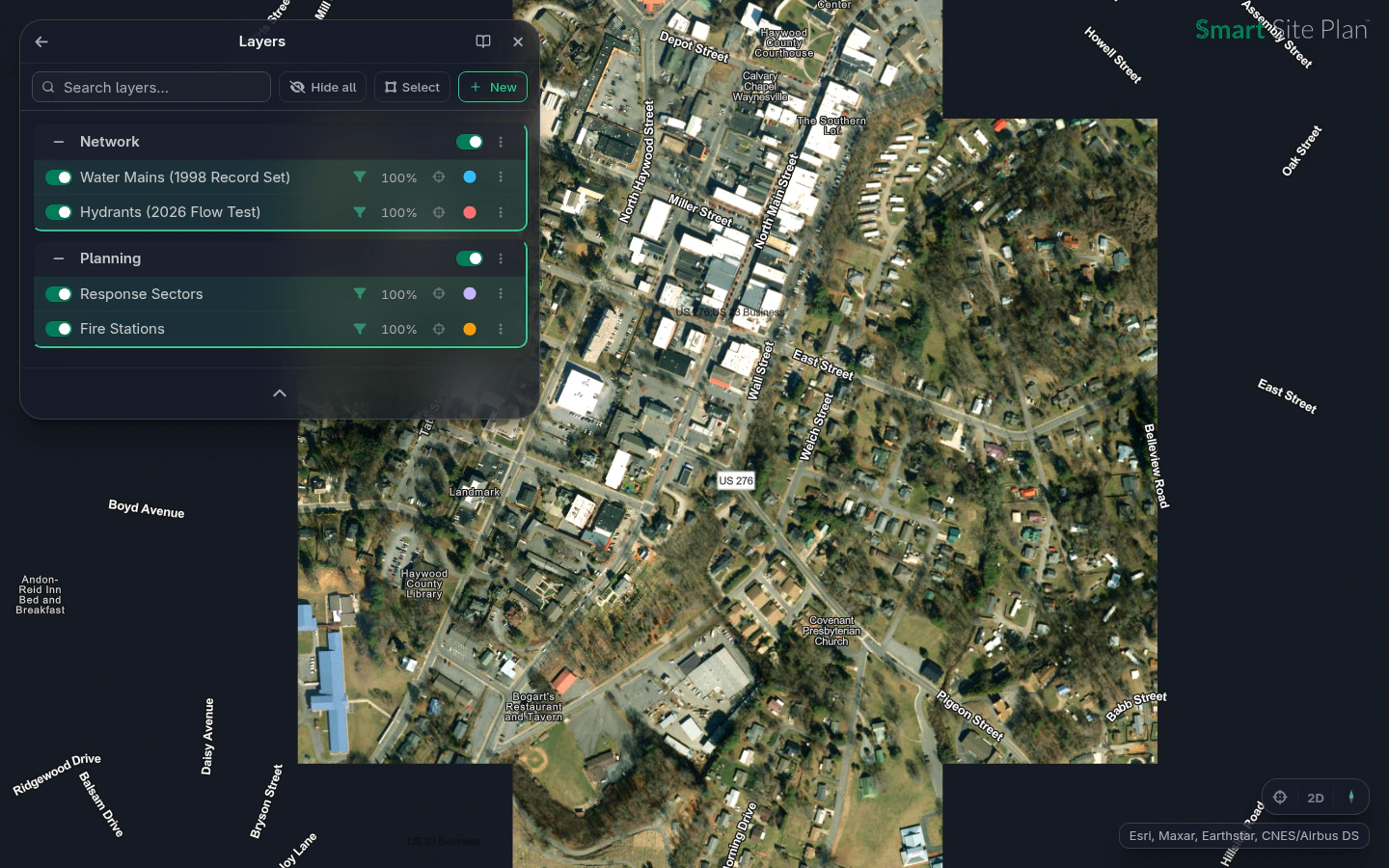 A hydrant flow-test program: hydrants and water mains along the real street grid, response sectors, and stations in the Layers panel